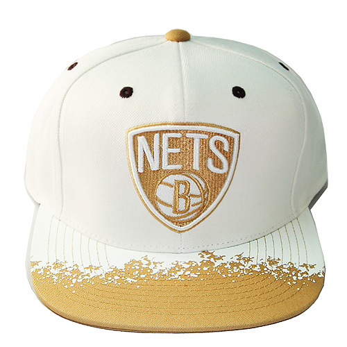 white and gold hat